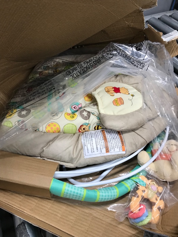 Photo 1 of Bright Starts Winnie the Pooh Dots & Hunny Pots Baby Bouncer with Vibrating Infant Seat, Music & 3 Playtime Toys, 23x19x23 Inch
