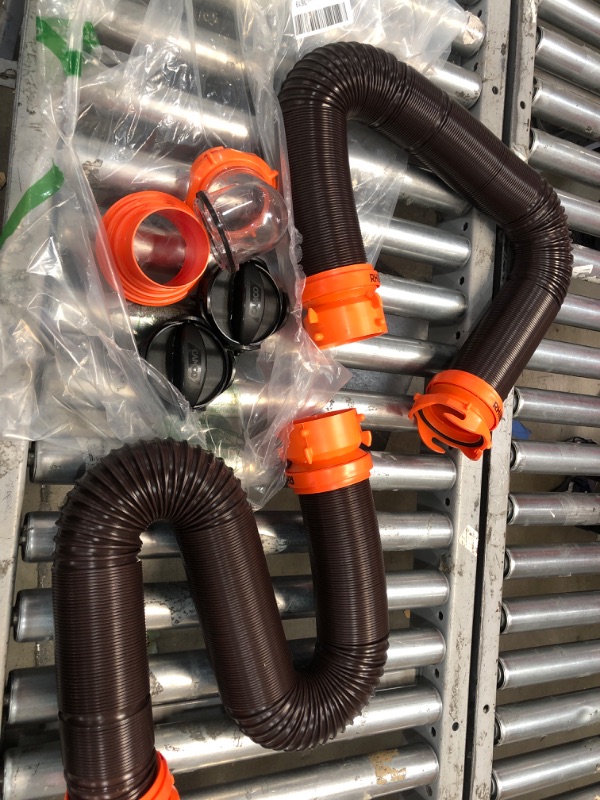 Photo 4 of Camco 20' (39742) RhinoFLEX 20-Foot RV Sewer Hose Kit, Swivel Transparent Elbow with 4-in-1 Dump Station Fitting-Storage Caps Included , Black , Brown 20ft Sewer Hose Kit Frustration-Free Packaging