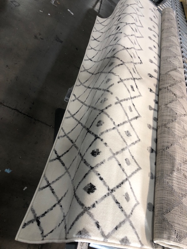 Photo 1 of **USED**  Off White Area Rug with Grey Design- 6'7" x 9'