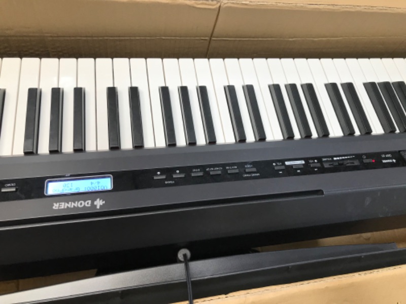 Photo 1 of Donner DEP-20 Beginner Digital Piano 88 Key Full Size Weighted Keyboard, Portable Electric Piano with Sustain Pedal, Power Supply