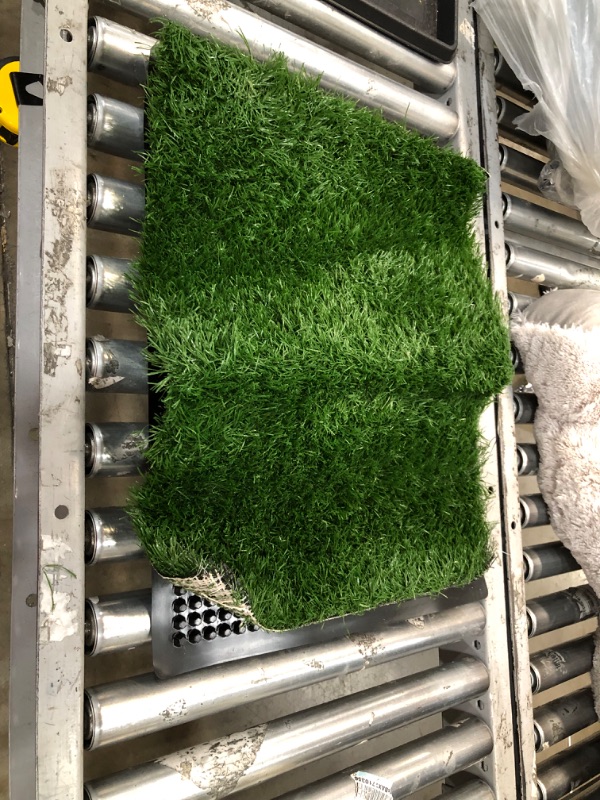 Photo 1 of **used item**
20 x 25 pet turf mat, view photos