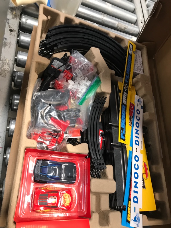 Photo 2 of Carrera GO!!! 62477 Disney Pixar Cars Neon Nights Electric Slot Car Racing Kids Toy Race Track Set Includes 2 Controllers and 2 Cars in 1:43 Scale Disney Cars Neon