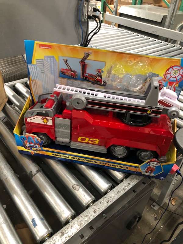 Photo 2 of Paw Patrol, Marshall’s Transforming Movie City Fire Truck with Extending Ladder, Lights, Sounds and Action Figure, Kids Toys for Ages 3 and up