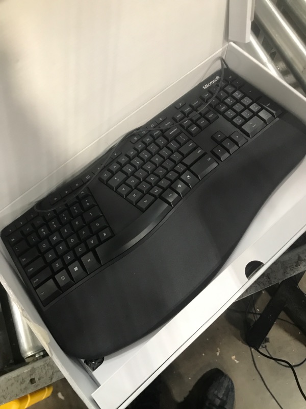 Photo 2 of Microsoft Ergonomic Keyboard - Black. Wired, Comfortable, Ergonomic Keyboard with Cushioned Wrist and Palm Support. Split Keyboard. Dedicated Office Key.