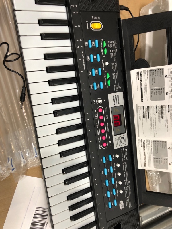 Photo 1 of WOSTOO Keyboard Piano, 61 Key Portable Keyboard with Built-In Speaker, Microphone, Music Stand, Power Supply, Electronic Keyboard for Beginners Musical Instrument Educational Toy for Kids Boy Girl 61Keys 