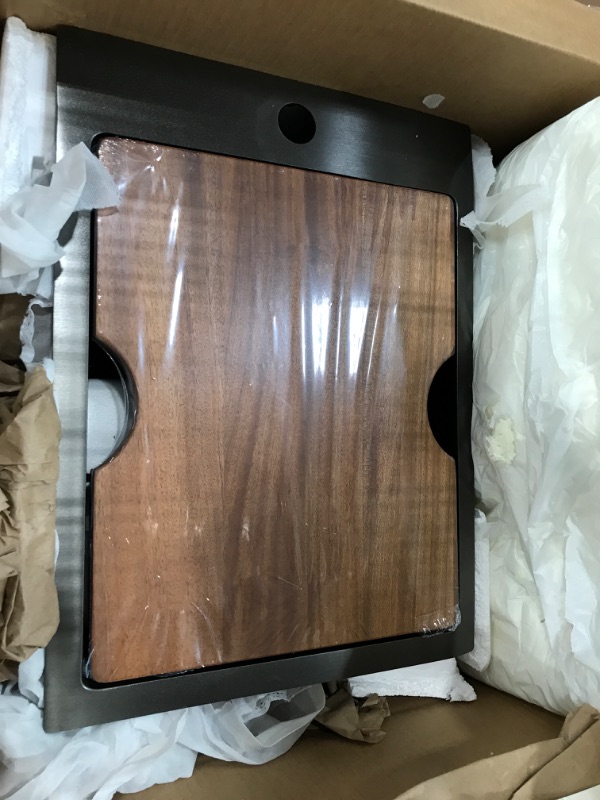Photo 1 of **No info found**
Black stainless steel kitchen sink, with wood cover