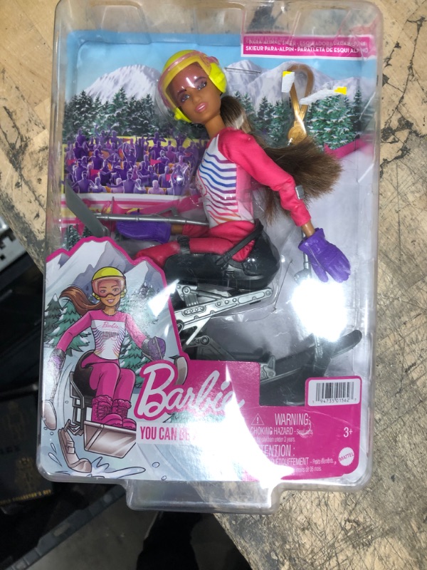 Photo 2 of Barbie Winter Sports para Alpine Skier Brunette Doll (12 in) with Shirt, Pants, Helmet, Gloves, Pole, Sit Ski & Trophy, Great Gift for Ages 3 and Up