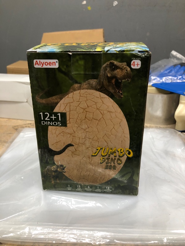 Photo 2 of Alyoen Dino Egg Dig Kit, Jumbo Dino Egg Dig with 13 Suprise Dinosaur Egg Toys in One Giant Filled Eggs, Dinosaur Eggs Excavation Kits for Kids 3-7, Boys Archaeology Science STEM Christmas/Xmas Gifts