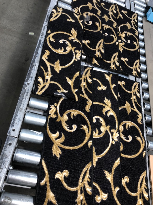 Photo 1 of 3 small black and gold rugs 26x9inch