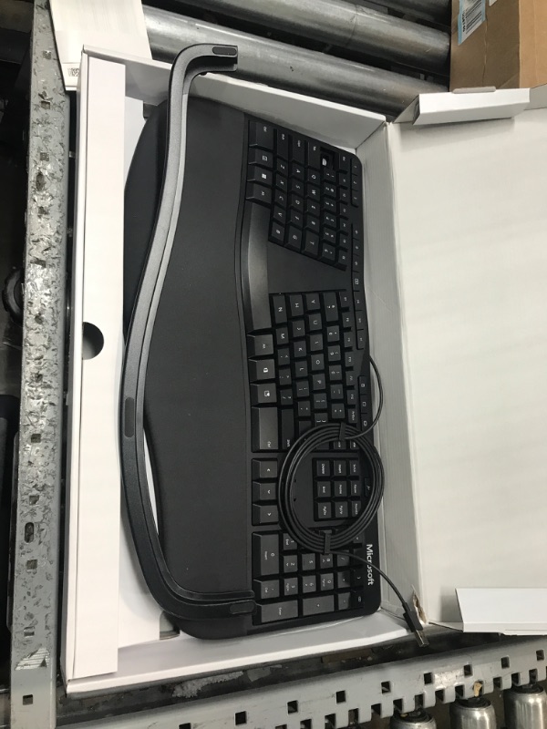 Photo 2 of Microsoft Ergonomic Keyboard - Black. Wired, Comfortable, Ergonomic Keyboard with Cushioned Wrist and Palm Support. Split Keyboard. Dedicated Office Key.