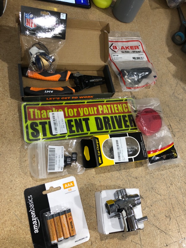 Photo 1 of Car Charger, student driver sticker ,amazon basic AAA batteries 8 pack, panel shower system nob, AKER key ring strap blk, red reflector marker light, American Mutt Tools wire strippers , capps O rugby blk, NFL foam head keychain 
