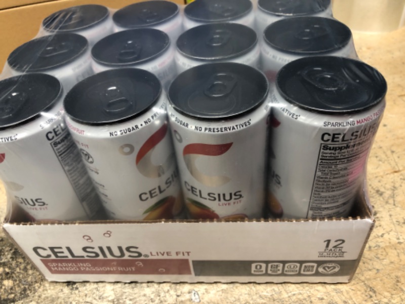 Photo 2 of *** EXP 01/24 *** CELSIUS Sparkling Mango Passionfruit, Functional Essential Energy Drink 12 Fl Oz (Pack of 12) Sparking Mango Passionfruit 12 Fl Oz (Pack of 12)