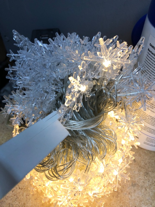 Photo 2 of *** POWERS ON *** MissionMax 100 LED Snowflake Christmas Fairy String Lights. 32.8' Plug in String Lights are The Perfect Decor for Indoor and Outdoor Use. Great Hanging Warm White Lights for Bedroom, Patio & More