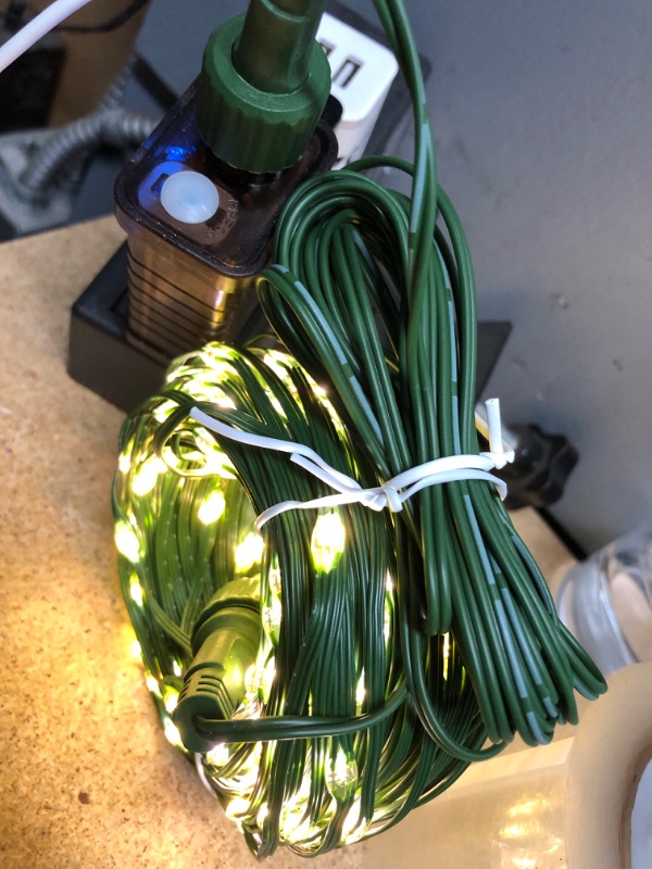 Photo 2 of *** POWERS ON *** TOUBIK 300 LED Christmas Lights Outdoor Indoor,110Ft 8 Modes Warm White & Multicolor End-to-End Connectable Fairy String Light Plug in for Xmas Tree Party Wedding Outside Decorations Warm White & Multicolor 300LEDS