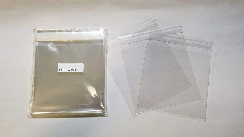 Photo 1 of UNIQUEPACKING 100 Pcs 5 3/16 X 5 1/16 Clear Resealable Cell/Cellophane Bags Good for 5x5 Square Card, pack of 40 (4,000 bags total) 
