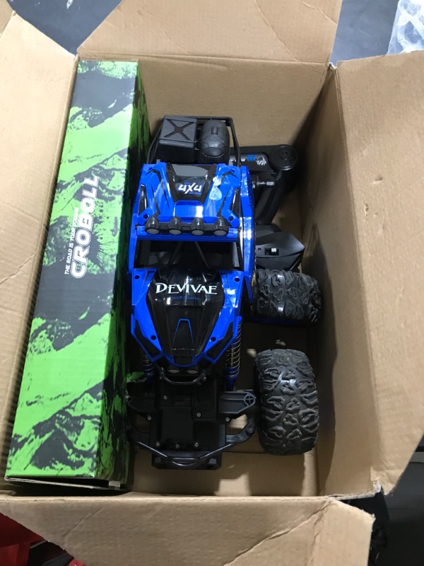 Photo 2 of CROBOLL 1:12 Large Remote Control Car for Boys Kids with Lifting Function,4WD RC Cars Electric Monster Truck Toy Gifts 4X4 Off-Road RC Rock Crawler 2.4GHz All Terrain RC Truck with 2 Batteries(Blue) 