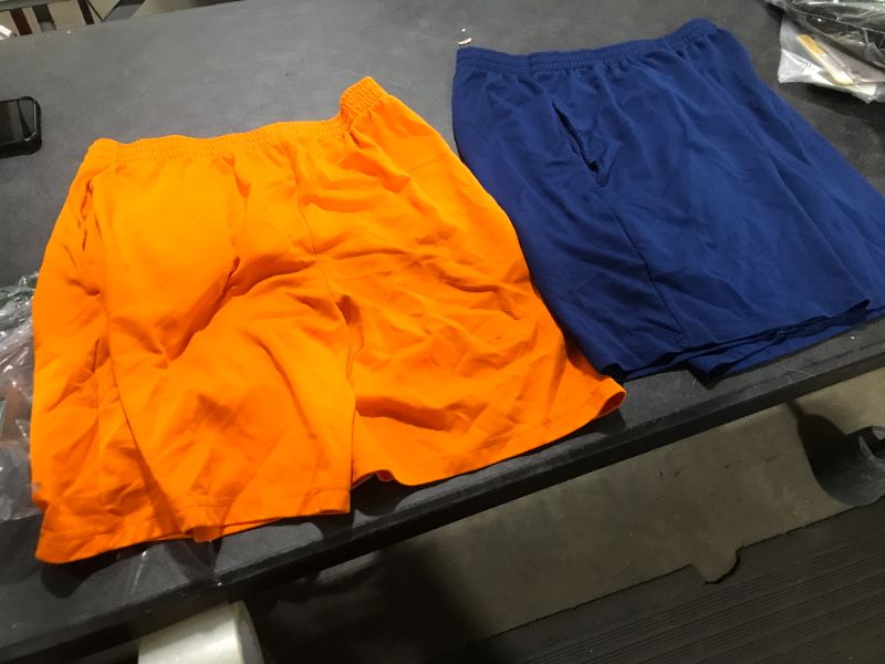 Photo 1 of 2 pairs of shorts orange and blue --- size medium