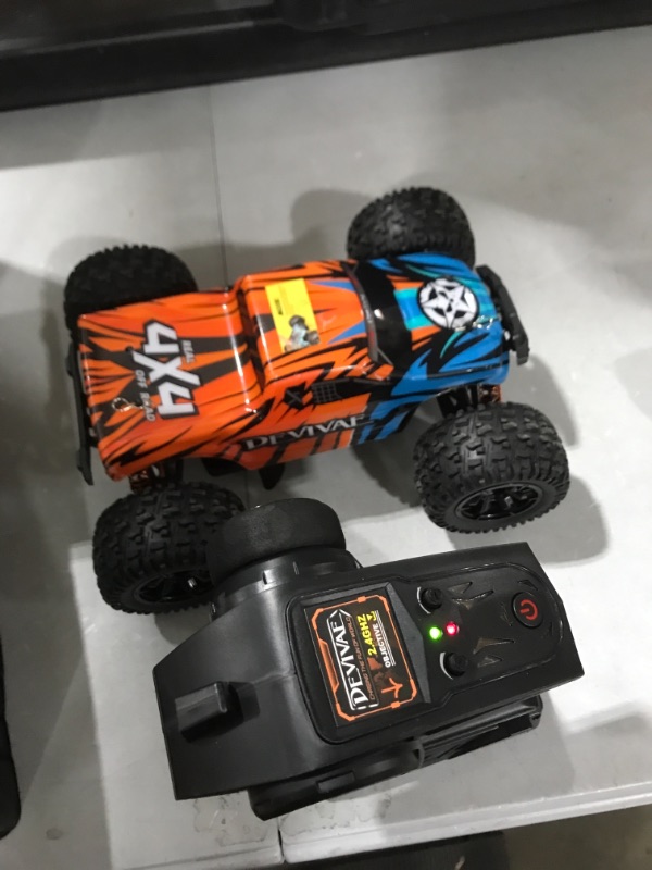 Photo 2 of DEVIVAE RC Cars 005 High Speed Remote Control Car for Kids Adults 1:18 Scale 36 KM/H 4X4 Off Road Monster Trucks, 2.4GHz All Terrain Electric Toy with 2 Batteries, 50 Mins Play Gift for Boy Girl BLUE ORANGE
