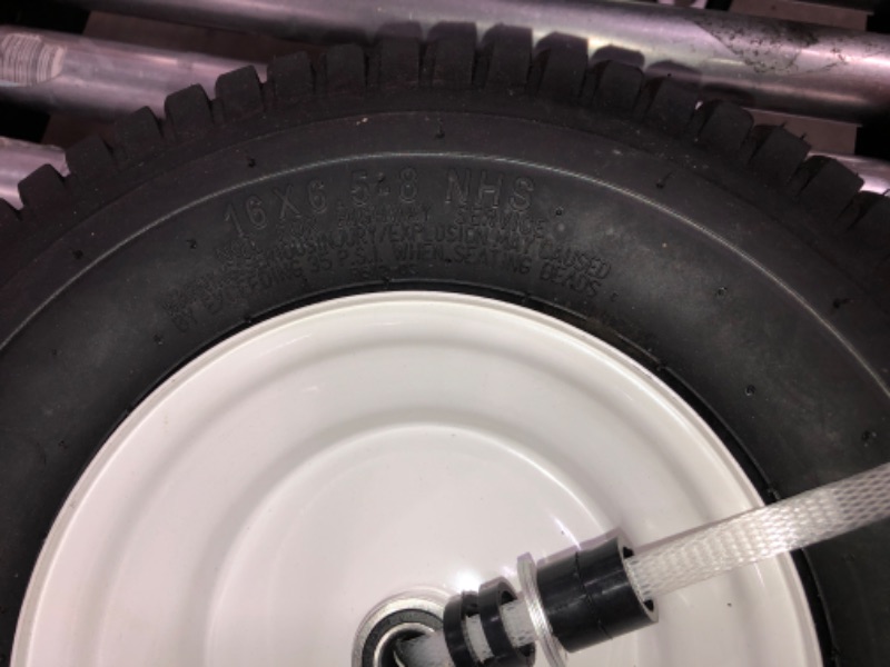 Photo 3 of 16x6 black tire white rim pair for unknown vehicle