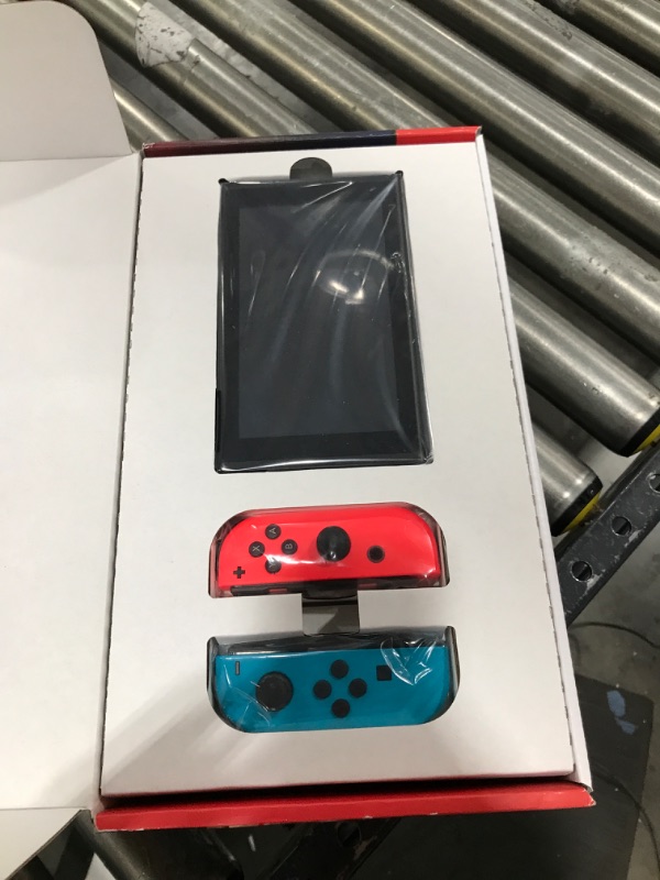 Photo 2 of Nintendo Switch with Neon Blue and Neon Red Joy?Con