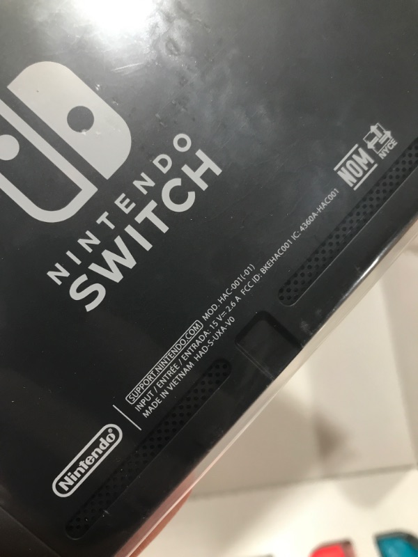 Photo 1 of Nintendo Switch with Neon Blue and Neon Red Joy?Con