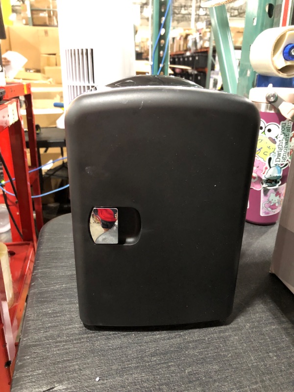Photo 1 of PERSONAL CHILLER Portable Mini Fridge Cooler and Warmer, 4 Liter Capacity Chills Six 12 oz Cans, Snacks, and Skincare Products, A/C Operation, 100% Freon-Free
