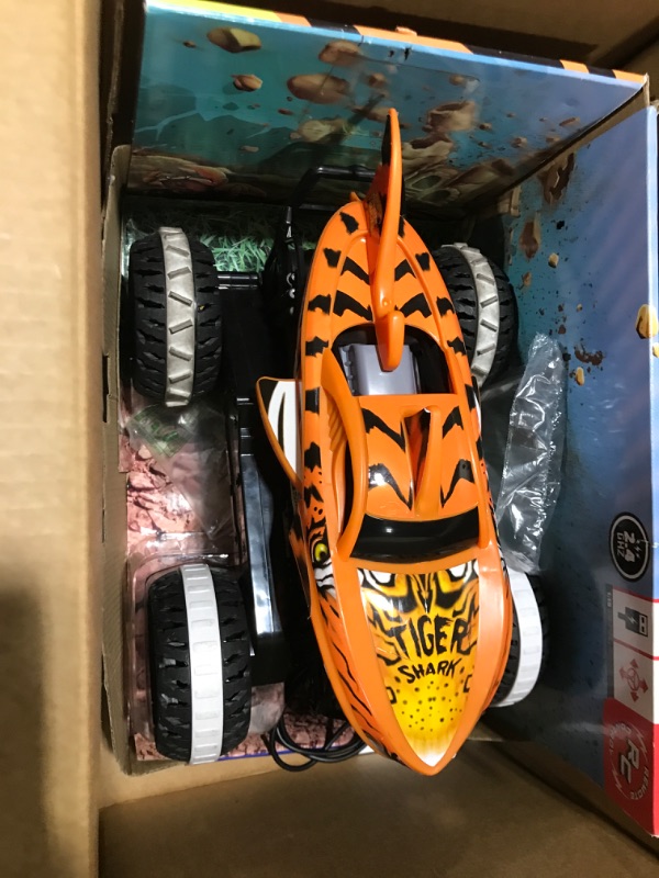 Photo 2 of Hot Wheels Monster Trucks, Remote Control Car, Monster Truck Toy with All-Terrain Wheels, 1:15 Scale Unstoppable Tiger Shark RC