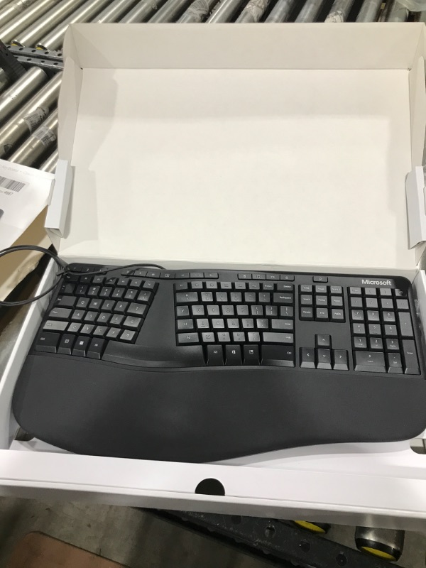 Photo 1 of Microsoft Ergonomic Keyboard - Black. Wired, Comfortable, Ergonomic Keyboard with Cushioned Wrist and Palm Support. Split Keyboard. Dedicated Office Key.