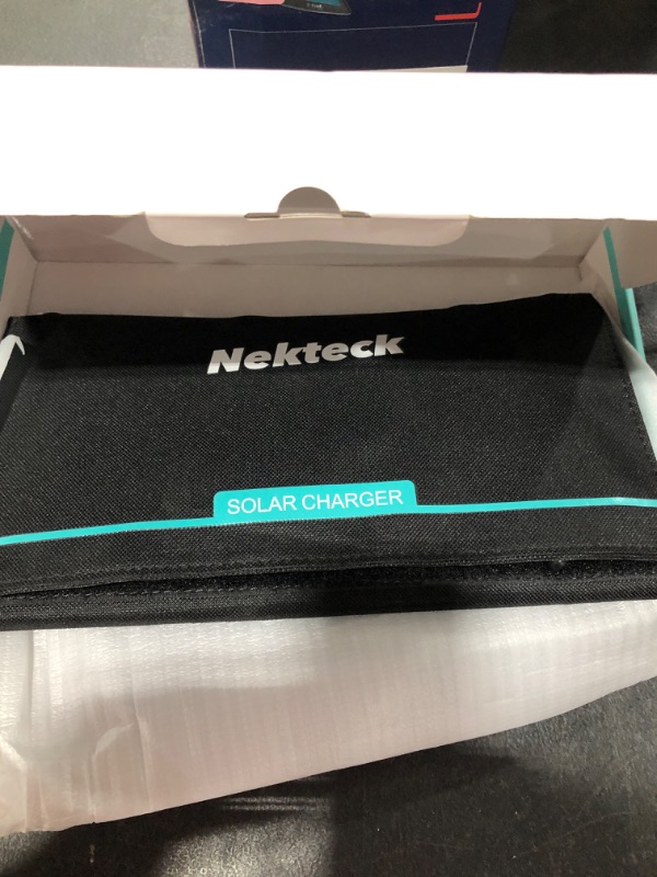 Photo 2 of Nekteck 21W Solar Charger(5V/3A Max) with 2 USB Port, IPX4 Waterproof Portable and Foldable Hiking Camping Gear SunPower USB Solar Panel Compatible with iPhone, iPad, Samsung Galaxy, and More
