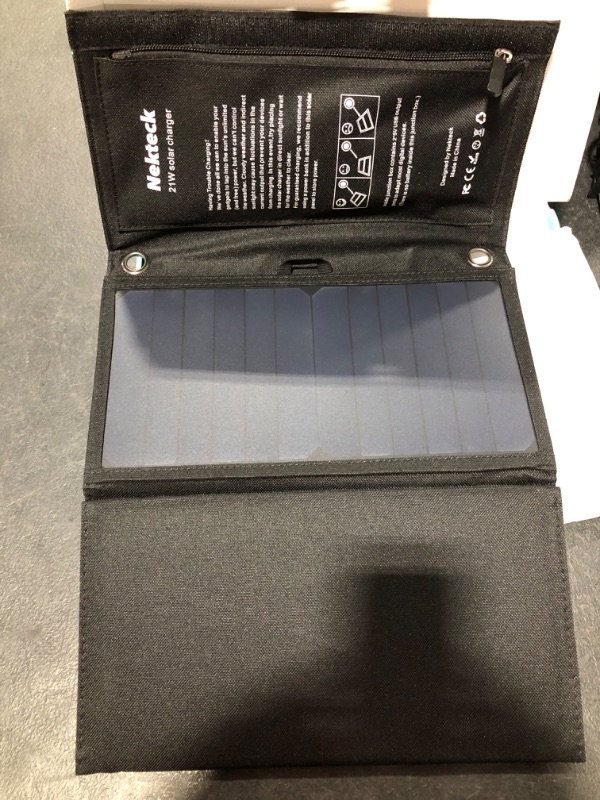 Photo 1 of Nekteck 21W Solar Charger(5V/3A Max) with 2 USB Port, IPX4 Waterproof Portable and Foldable Hiking Camping Gear SunPower USB Solar Panel Compatible with iPhone, iPad, Samsung Galaxy, and More
