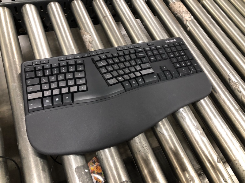 Photo 2 of Microsoft Ergonomic Keyboard - Black. Wired, Comfortable, Ergonomic Keyboard with Cushioned Wrist and Palm Support. Split Keyboard. Dedicated Office Key.