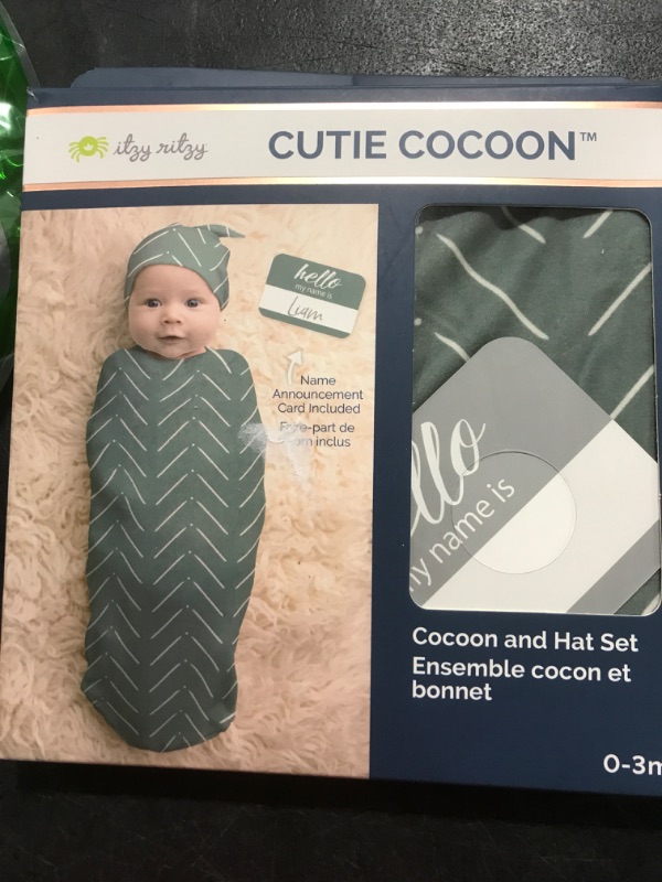 Photo 2 of Itzy Ritzy Cocoon & Hat Swaddle Set, Cutie Cocoon Includes Name Announcement Card & Matching Jersey Knit Cocoon & Hat Set, Perfect for Newborn Photos, for Ages 0 to 3 Months, Sage Mudcloth Sage Mudcloth One Size