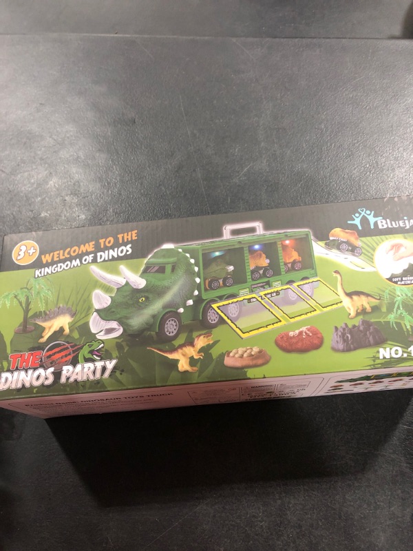 Photo 1 of BLUEJAY 21 Pack Dinosaur Toys for Kids 3-7, Dinosaur Truck with Oversized Dinosaur Map, Flashing Lights, Music and Roaring Sound, Kids Toys with 6 Pull Back Dinosaur Cars, 6 Dinosaur Toys (Green)