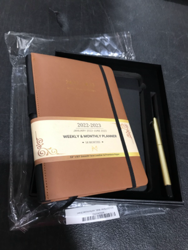 Photo 2 of Modern Mercantile Planner 2022-2023 - 5.8" x 8.3" Jan 2022 - June 2023 Monthly Planner with Weekly and Monthly Planning, Faux Leather Hard Cover, Gold Pen, Book Case, Bookmark and Elastic Band Brown