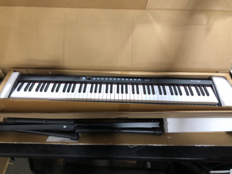 Photo 1 of Starfavor Piano Keyboard 88 Keys Keyboard, Semi-weighted Keyboard Piano 88 Key Piano, with Keyboard Stand, Sustain Pedal, and Carrying Case, SEK-88A
