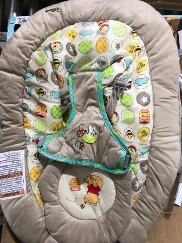 Photo 2 of Bright Starts Winnie the Pooh Dots & Hunny Pots Baby Bouncer with Vibrating Infant Seat, Music & 3 Playtime Toys, 23x19x23 Inch