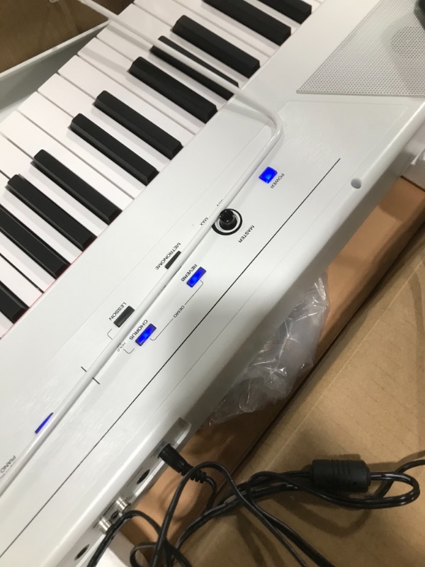 Photo 3 of Alesis Recital – 88 Key Digital Piano Keyboard with Semi Weighted Keys, 5 Voices, Piano Lessons, M-Audio Sustain Pedal and HDH40 Piano Headphones Recital White Piano + Sustain Pedal + Headphones