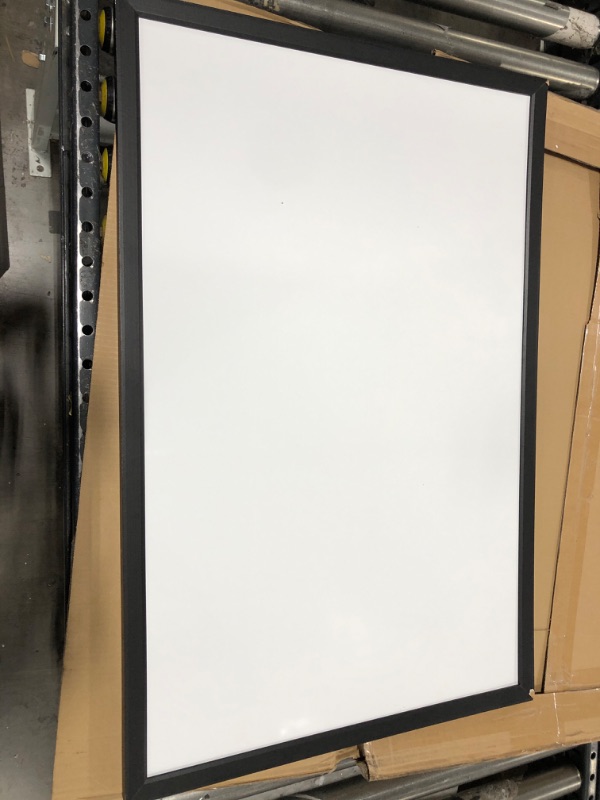 Photo 2 of Amazon Basics Magnetic Dry Erase White Board, 35 x 23-Inch Whiteboard - Black Wooden Frame 23"x35" Magnetic, Wood Frame