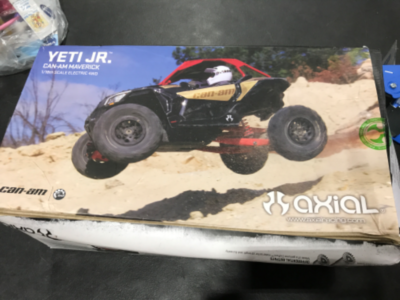 Photo 5 of Axial Yeti Jr. Can-Am Maverick X3 RC Rock Racer 4WD Brushed Off-Road Side-by-Side 1/18 Scale RTR (Includes 2.4 Ghz Transmitter, Battery & Charger): AXI90069,Red, Gold and black