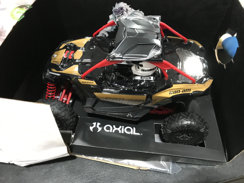 Photo 2 of Axial Yeti Jr. Can-Am Maverick X3 RC Rock Racer 4WD Brushed Off-Road Side-by-Side 1/18 Scale RTR (Includes 2.4 Ghz Transmitter, Battery & Charger): AXI90069,Red, Gold and black