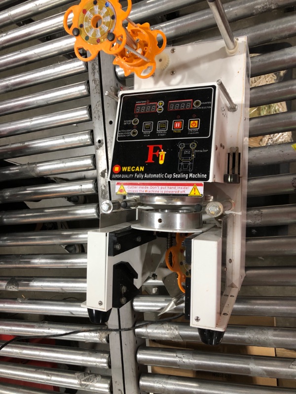 Photo 1 of  Fully Automatic Sealing Machine--machine is dirty