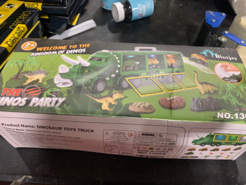 Photo 2 of BLUEJAY 21 Pack Dinosaur Toys for Kids 3-7, Dinosaur Truck with Oversized Dinosaur Map, Flashing Lights, Music and Roaring Sound, Kids Toys with 6 Pull Back Dinosaur Cars, 6 Dinosaur Toys (Green)