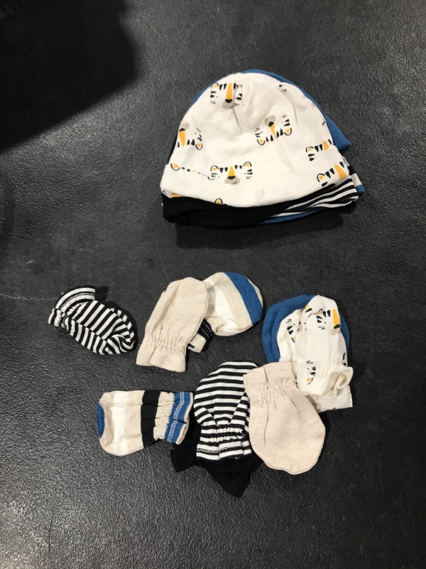 Photo 1 of Baby gloves and hates, New born
