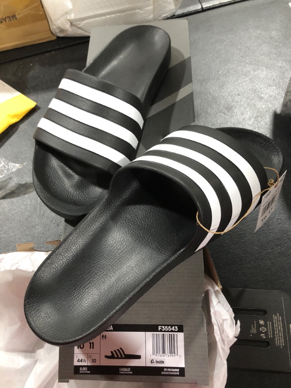 Photo 2 of adidas Unisex-Adult Adilette Aqua Slides Sandal 11 Women/10 Men Core Black/White/Core Black 