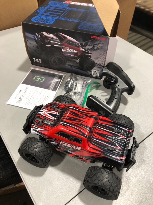 Photo 2 of BEZGAR TM141 RC Truck 1:14 Scale Remote Control Car, 4WD High Speed All Terrains Electric Toy Off Road RC Car Vehicle Truck Crawler with Two Rechargeable Batteries for Boys Kids and Adults Black-red