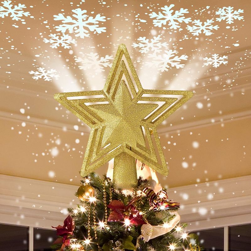 Photo 1 of AHCCSD Christmas Tree Topper,10 Inch Xmas Tree Gold Star Lighted with Led Rotating Magic Snowflake Projector 3D Hollow Glitter 16 ft Wire for Holiday Christmas Tree Decoration
