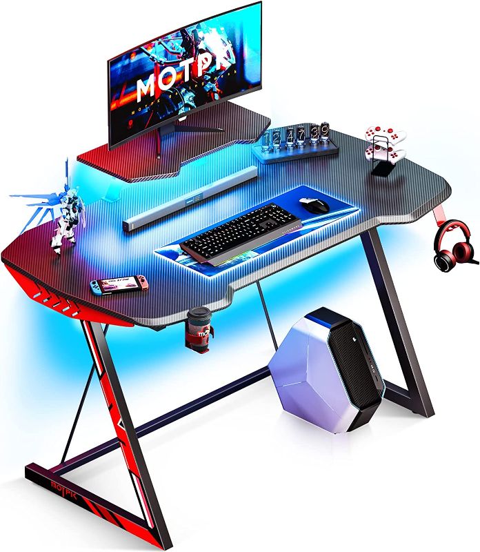 Photo 1 of MOTPK Gaming Desk with LED Lights, Small Gaming Table Desk 39 inch Z Shaped, Gamer Desk Ergonomic Sturdy, Kids Computer Desk with Monitor Stand Cup Holder and Headphone Hook, Black, Gift Idea
