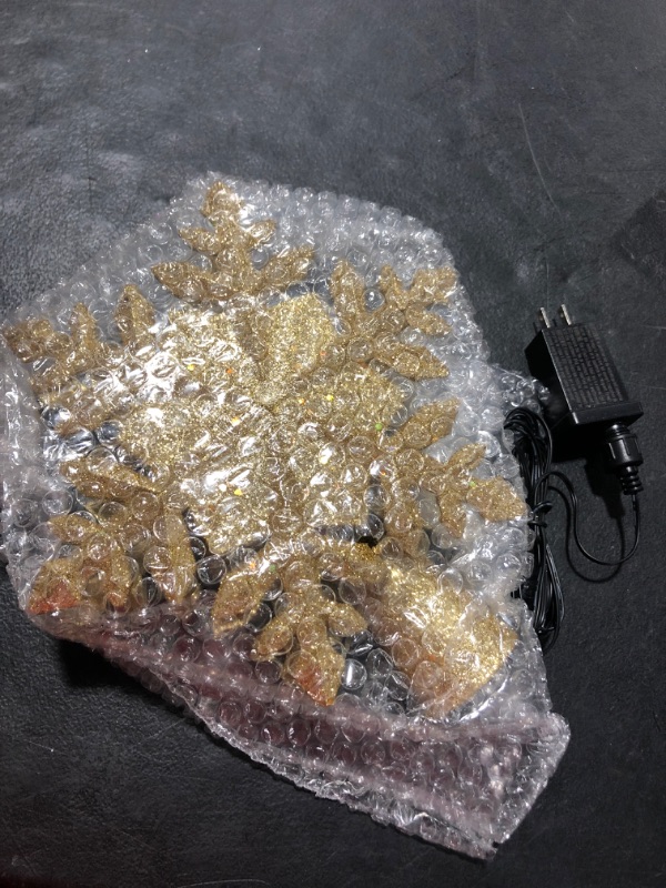 Photo 1 of COOLWUFAN Christmas Tree Topper Lighted with LED Rotating Snowflake Projector Lights, 2-in-1 Gold Glittered 5 Point 9.8 Inch Star Tree Topper Snowfall Lights for Xmas Tree Decoration Silver