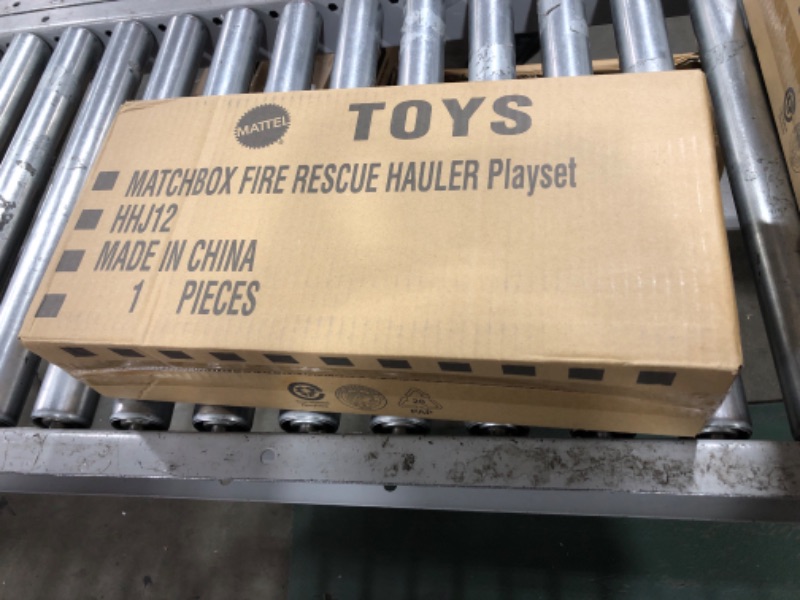 Photo 2 of ?Matchbox Fire Rescue Hauler Playset Themed Hauler with 1 Fire-Themed Vehicle, Holds 16 Cars, Easy-Release Ramp, 8 Accessories & Storage, for 3 & Up [Amazon Exclusive]