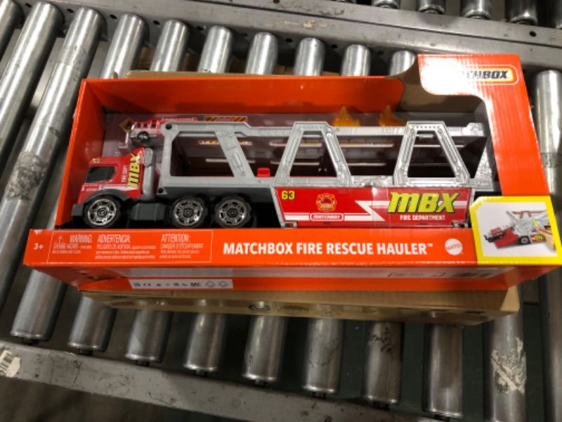 Photo 3 of ?Matchbox Fire Rescue Hauler Playset Themed Hauler with 1 Fire-Themed Vehicle, Holds 16 Cars, Easy-Release Ramp, 8 Accessories & Storage, for 3 & Up [Amazon Exclusive]